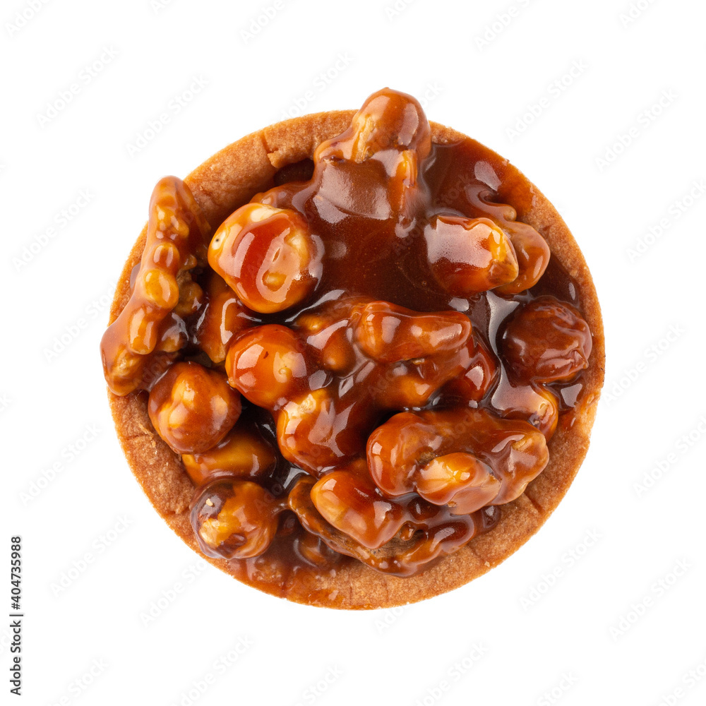 Isolated tartlet with nougat and hazelnuts on the white background Isolated tartlet with nougat and hazelnuts on the white background