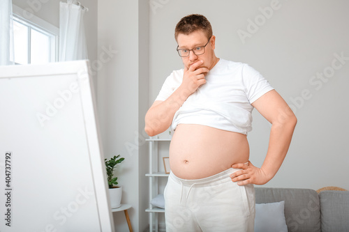 Stressed overweight man nea...