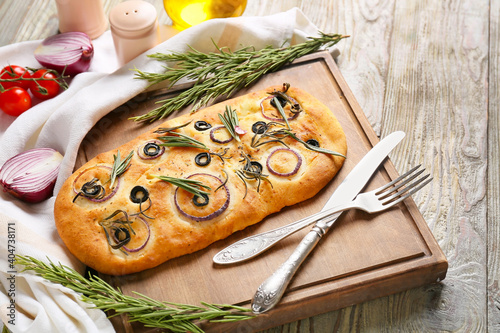 Composition with traditional Italian focaccia on wooden background