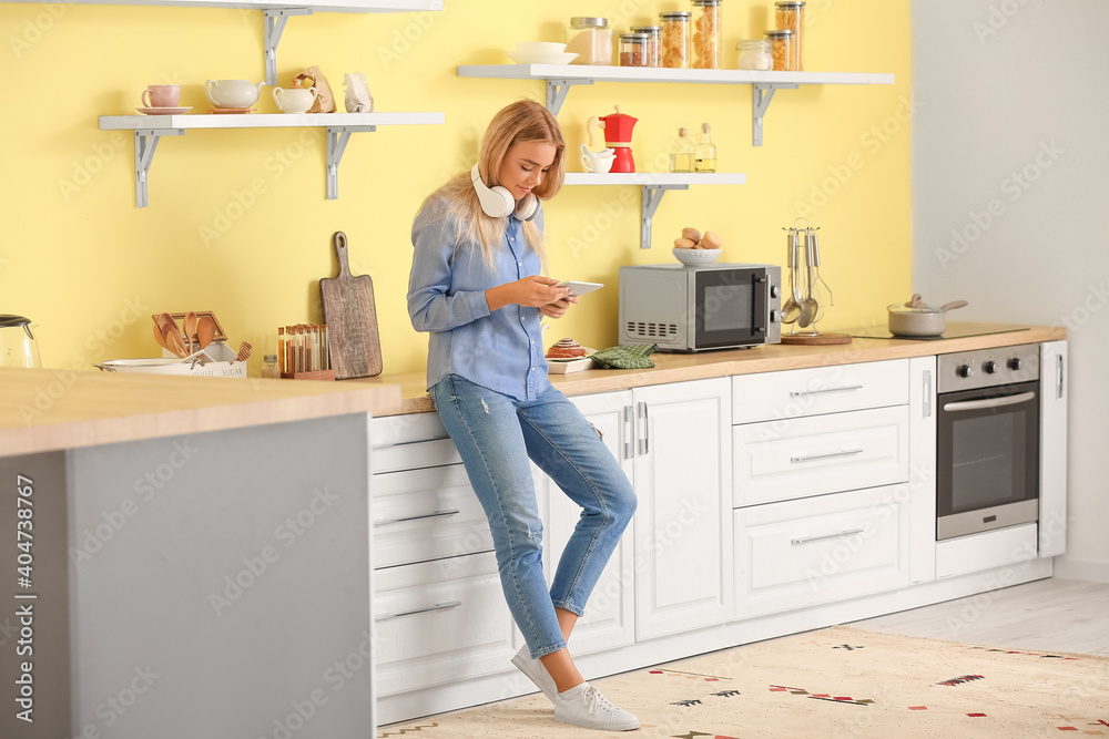Teenage girl with headphones and tablet computer at home Teenage girl with headphones and tablet computer at home