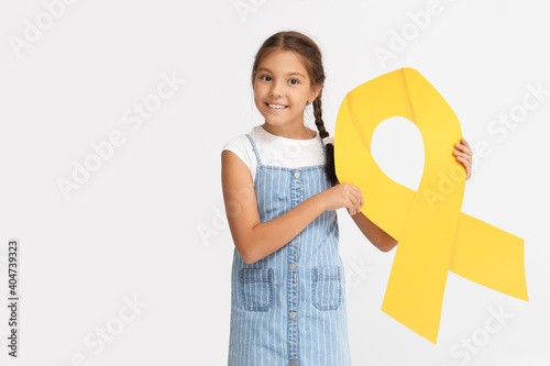 Little girl with golden rib...