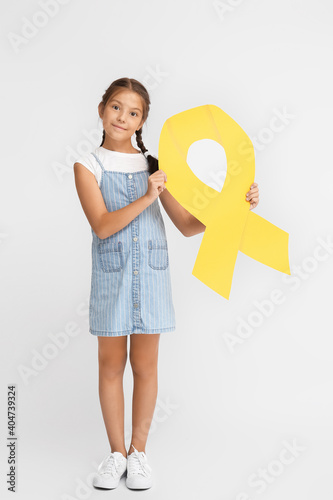Little girl with golden rib...