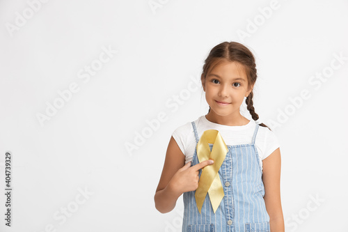 Little girl with golden rib...