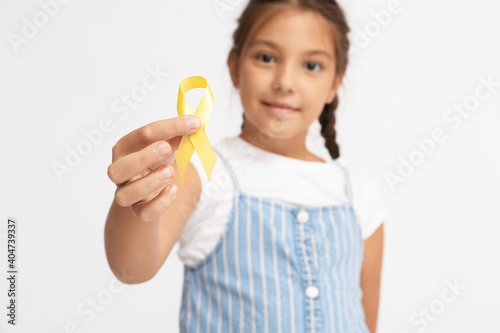 Little girl with golden rib...