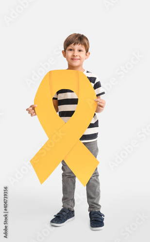 Little boy with golden ribb...
