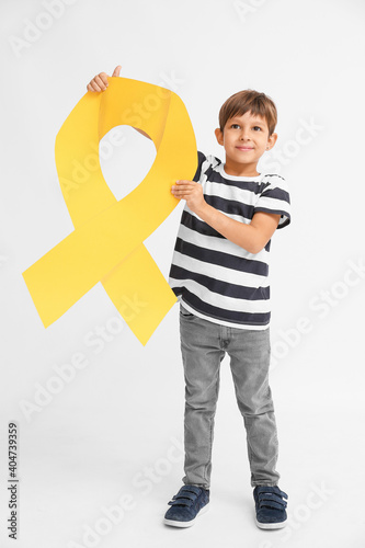 Little boy with golden ribb...