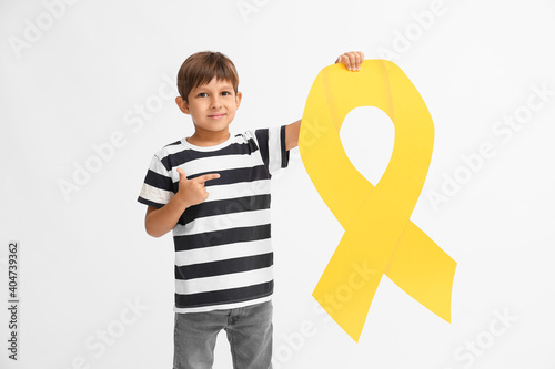 Little boy with golden ribb...