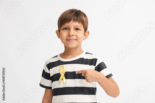 Little boy with golden ribb...