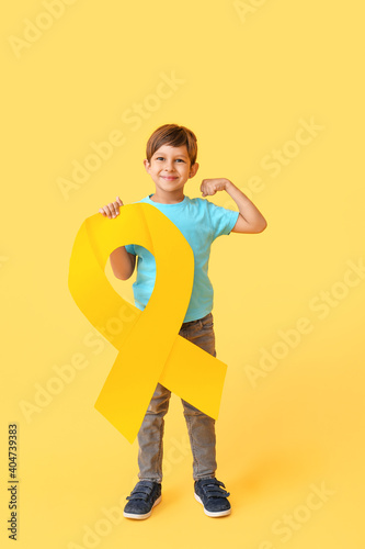 Little boy with golden ribb...