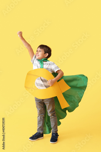 Little boy with golden ribb...