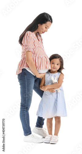 Pregnant Asian woman with her family on white background