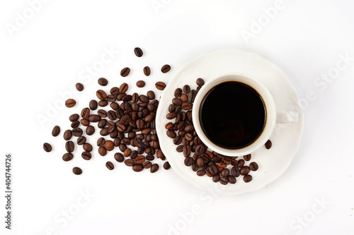 Coffee cup and coffee beans isolated on white background. Top view.
