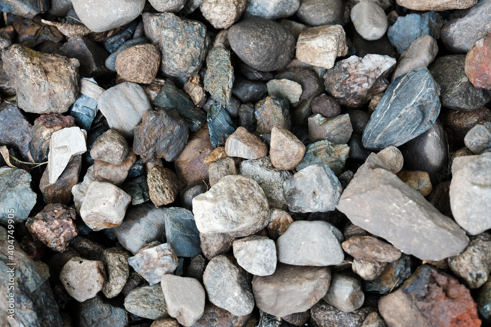 Pebbles background. Light color pebble rocks texture. Pebbles background. Light color pebble rocks texture.