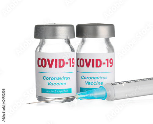 Vaccine for immunization against COVID-19 and syringe on white background