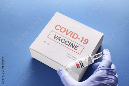 Doctor's hand with vaccine ...