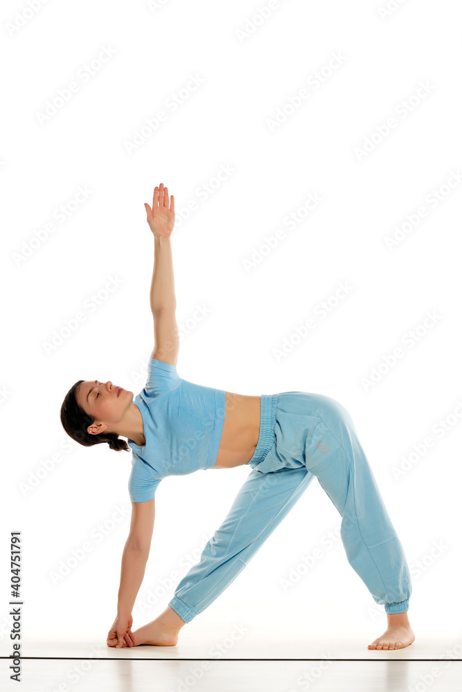 Fit yoga woman doing yoga pose, isolated on white background.