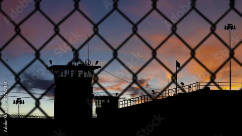 Prison at Sunrise with Guard Towers and Fence - Shallow DOF - 3D Illustration Animation