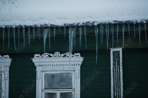 Ice icicles hang from the roof.