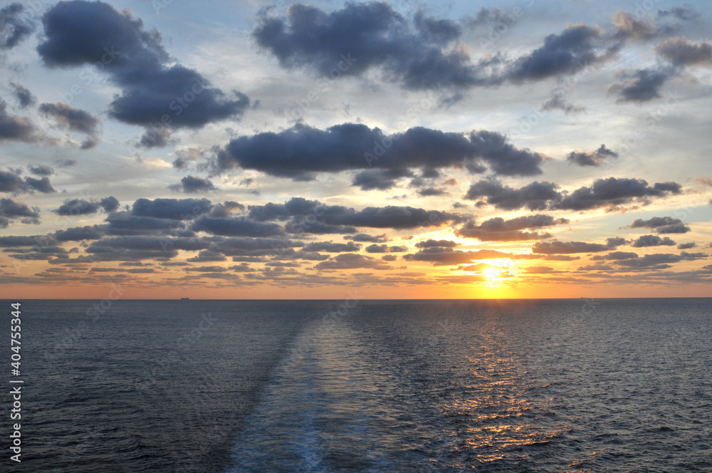 Fototapeta premium Sunset over the Atlantic ocean seen from a cruise ship 