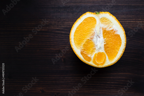 sliced orange on a dark rustic wooden table