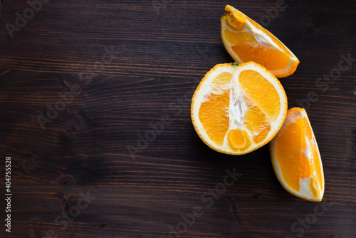 sliced orange on a dark rustic wooden table
