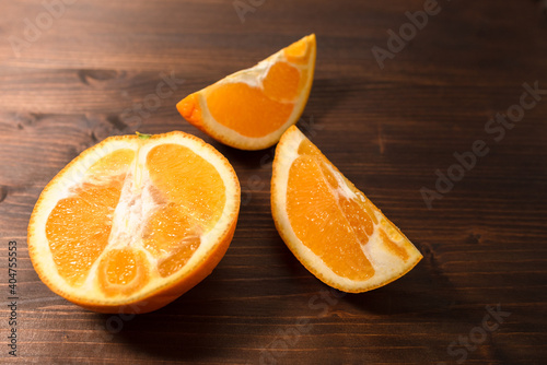 sliced orange on a dark wooden table
