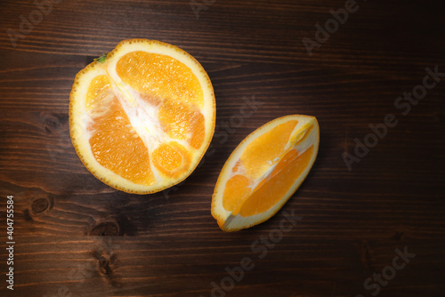 sliced orange on a dark rustic wooden table