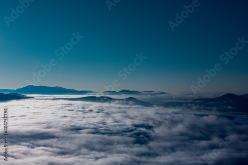 Beautiful white clouds over the mountains. Mountain landscape. Forest and mountains.