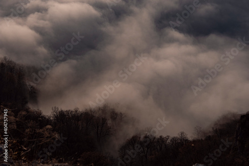 Beautiful white clouds over the mountains. Mountain landscape. Forest and mountains.