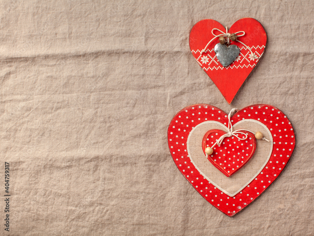 Flatlay hearts on a linen tablecloth. Valentine's Day background. Copy space. Flatlay hearts on a linen tablecloth. Valentine's Day background. Copy space.