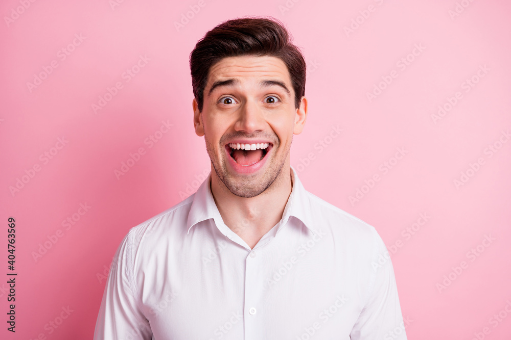 Portrait of optimistic guy wear white shirt isolated on pink color background Portrait of optimistic guy wear white shirt isolated on pink color background
