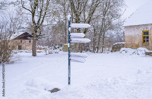 snow covered signpost
