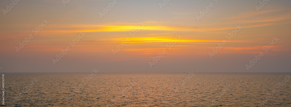 wide angle shot of beautiful sunset on tropical sea at summer time from tilt-shift lens for banner background