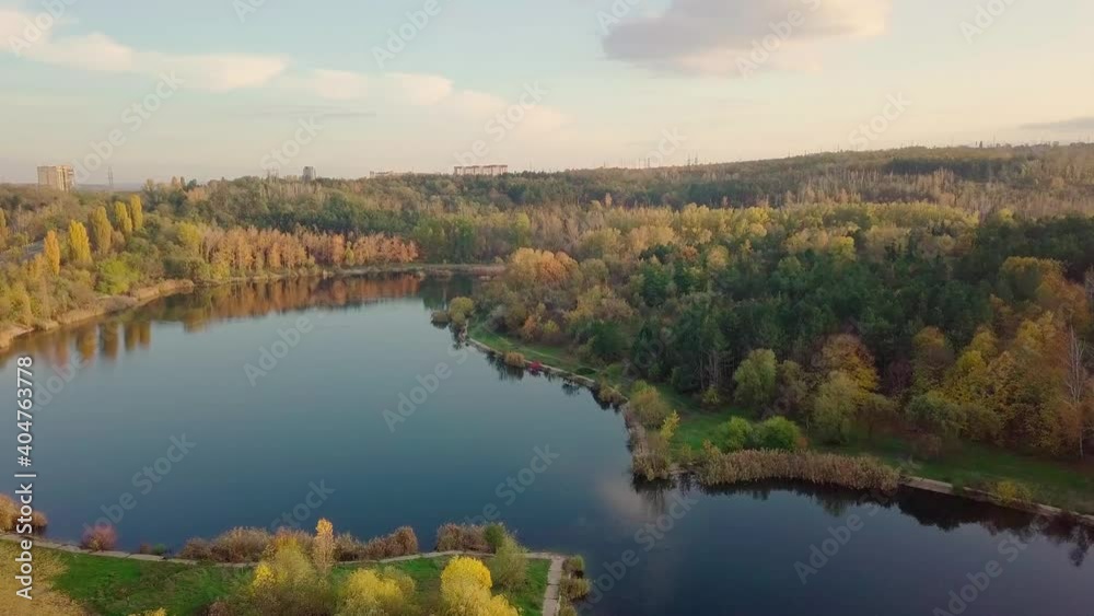 Aerial view with drone over a city, House located in the middle of the park. Beautifully protected lake. The city of Chisinau seen from above. Beautiful autumn landscape. Aerial view with drone over a city, House located in the middle of the park. Beautifully protected lake. The city of Chisinau seen from above. Beautiful autumn landscape.
