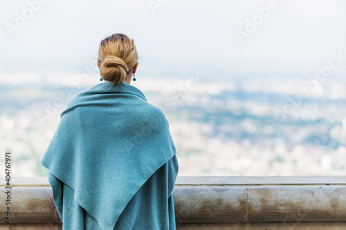 Back view of pensive lonely young woman looking into the distance © ulzanna