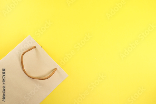 Paperbag isolated on the yellow background 