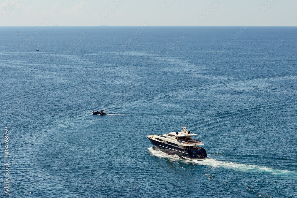 Fototapeta premium expensive black yacht on the high seas