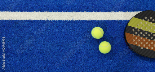 Obraz na plátně Close up of padel balls and racket on a blue syntehtic playground