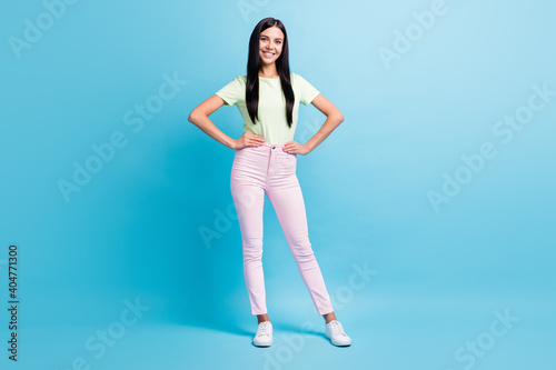 Full length body size view of pretty slender tall cheerful girl wearing spring look posing isolated over bright blue color background