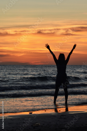 silhouette of person jumping on the beach