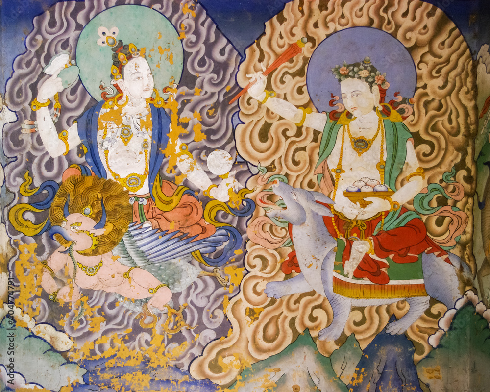 Colorful traditional wall painting of peaceful female deities riding their mount in Gangtey gompa or monastery, Phobjikha valley, Bhutan