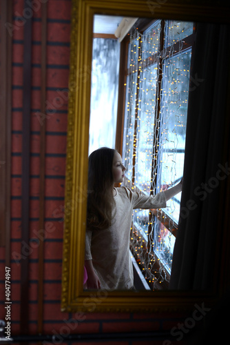 girl looking out the window at winter park