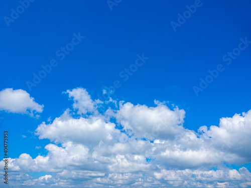 Bright blue sky with clouds and creative text input space