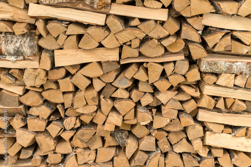 The woodpile, firewood as a background, chopped wood masonry The woodpile, firewood as a background, chopped wood masonry