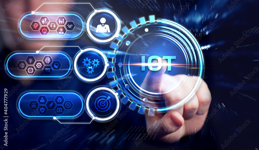 Obraz premium Internet of things - IOT concept. Businessman offer IOT products and solutions. Young businessman select the abstract chip with text IoT on the virtual display