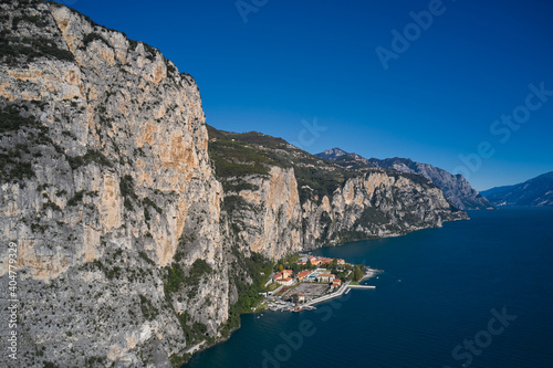 Aerial view at high altitude of the town by the cliff. Town Campione Lake Garda Italy. Panoramic view of the old town of Campione. Italian resort on Lake Garda.