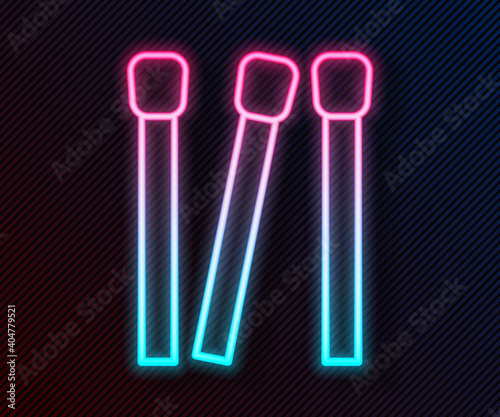 Glowing neon line Matches icon isolated on black background. Vector.