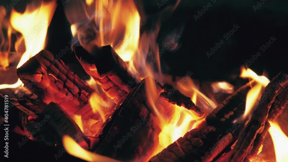 Bonfire burning coal closeup large fire in night. Orange flame on black backdrop Bonfire burning coal closeup large fire in night. Orange flame on black backdrop