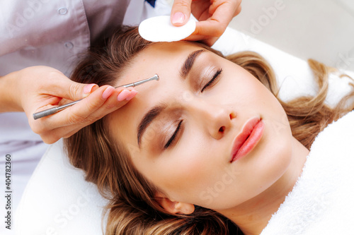 A procedure for mechanical or manual face cleansing by a beautician. Professional skin peeling. Hygiene for the skin. photo