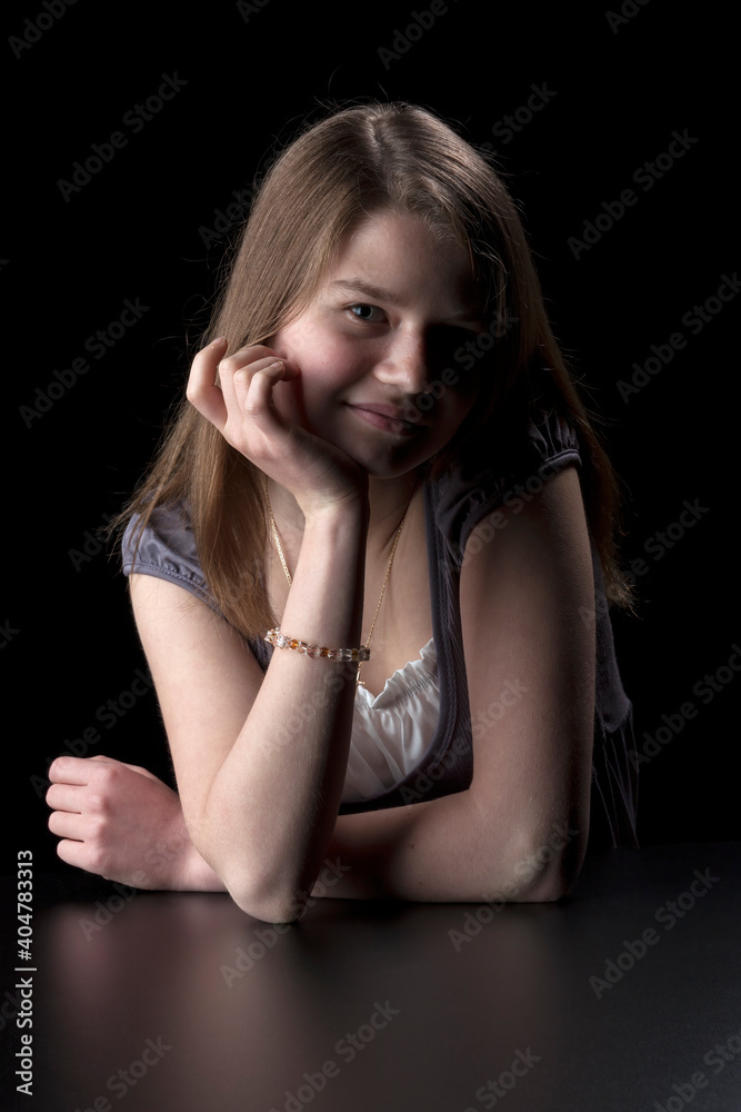 Naklejka premium Portrait of young girl with long brown hair